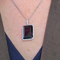Garnet and diamond pendant in white gold