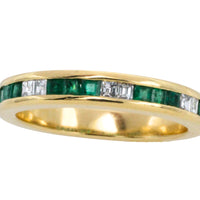 Emerald and diamond band in 18 carat gold