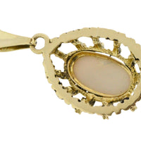 Cabochon opal pendant in 14 carat gold