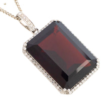 Garnet and diamond pendant in white gold