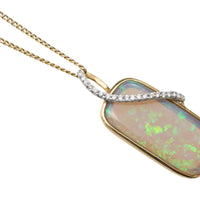 Opal and diamond pendant in 18 carat gold