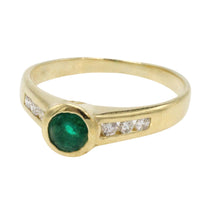 Emerald and diamond ring in 18 carat gold