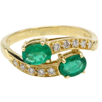 Vintage smaragd en diamanten kruiszetting ring