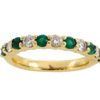Emerald and diamond band in 18 carat gold