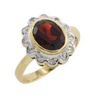 Garnets and diamond ring in 14 carat gold