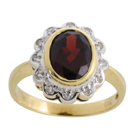 Garnets and diamond ring in 14 carat gold