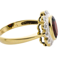 Garnets and diamond ring in 14 carat gold