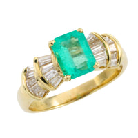 Emerald and baguette cut diamond ring in 18 carat gold