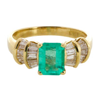 Emerald and baguette cut diamond ring in 18 carat gold