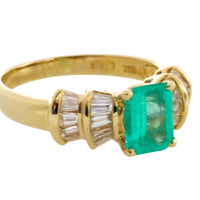 Emerald and baguette cut diamond ring in 18 carat gold