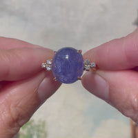 Cabouchon geslepen tanzaniet en diamanten ring