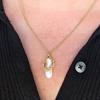 Baroque pearl and diamond pendant in 14 carat gold