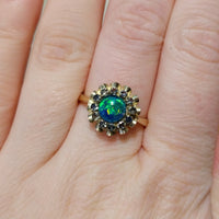 Opal doublet and sapphire cluster ring