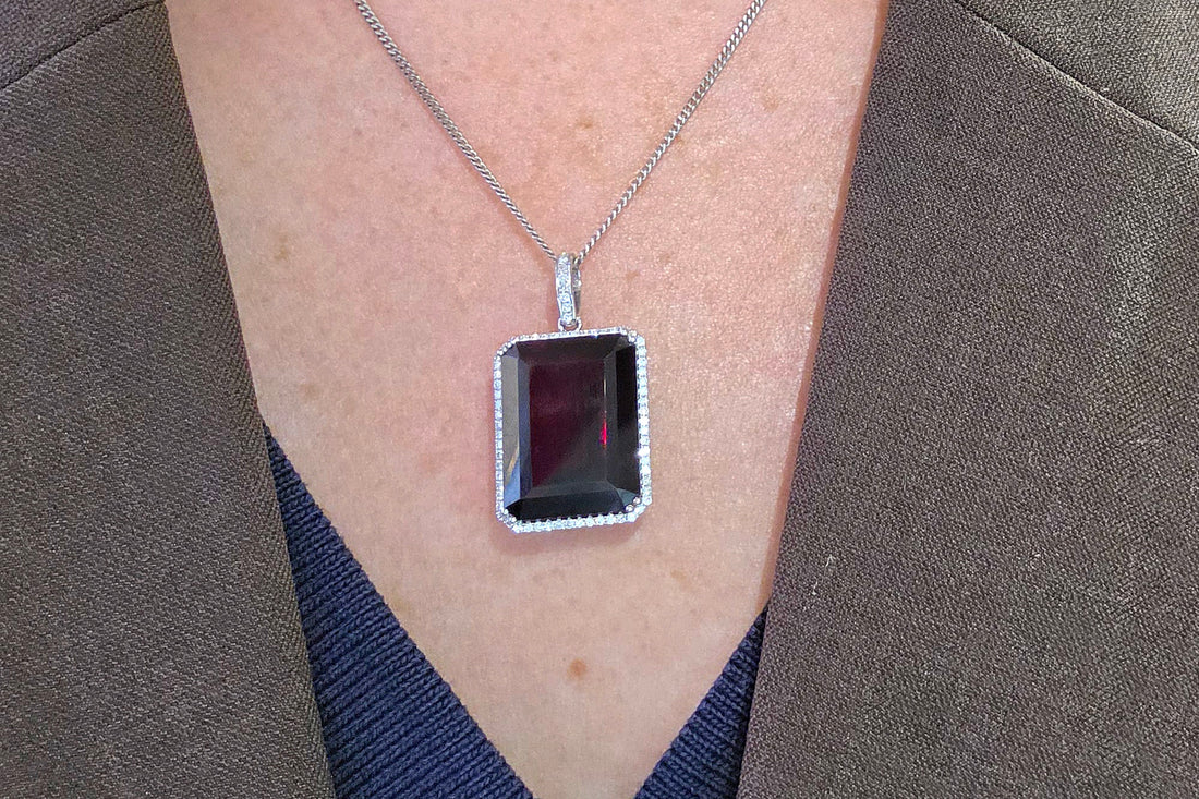 Garnet and diamond pendant in white gold
