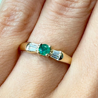 Emerald and baguette diamond ring in 18 carat gold