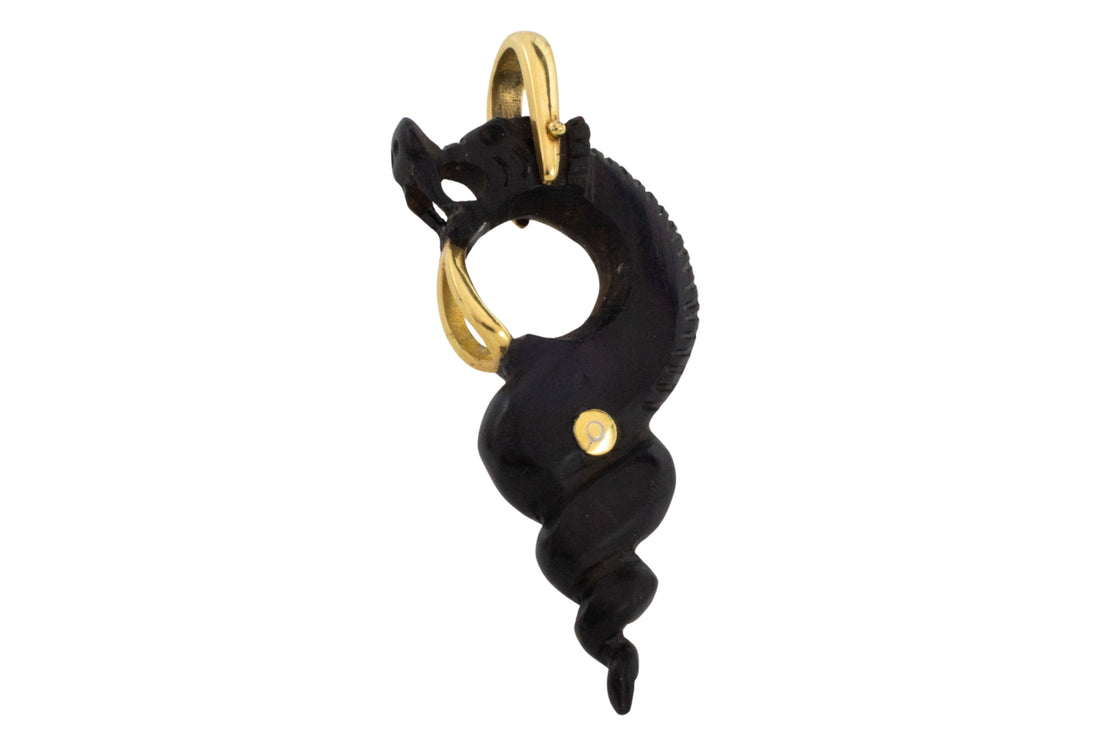 Ebony gold and ruby serpent pendant
