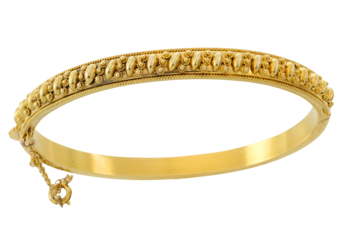 Vintage hinged bracelet in 14 carat gold