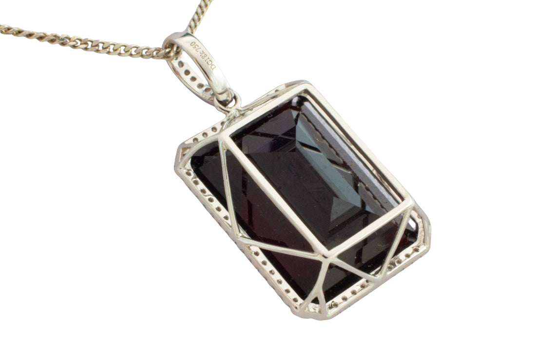 Garnet and diamond pendant in white gold