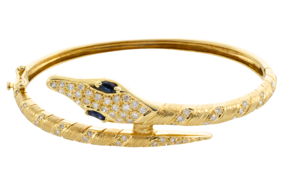 18 carat snake bracelet with diamonds and sapphires