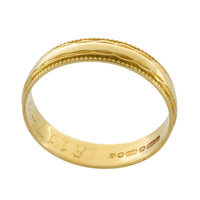 Vintage 18 carat gold band with motif