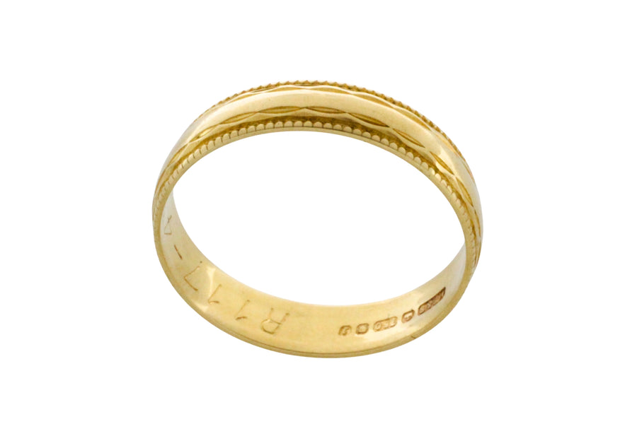 Vintage 18 carat gold band with motif