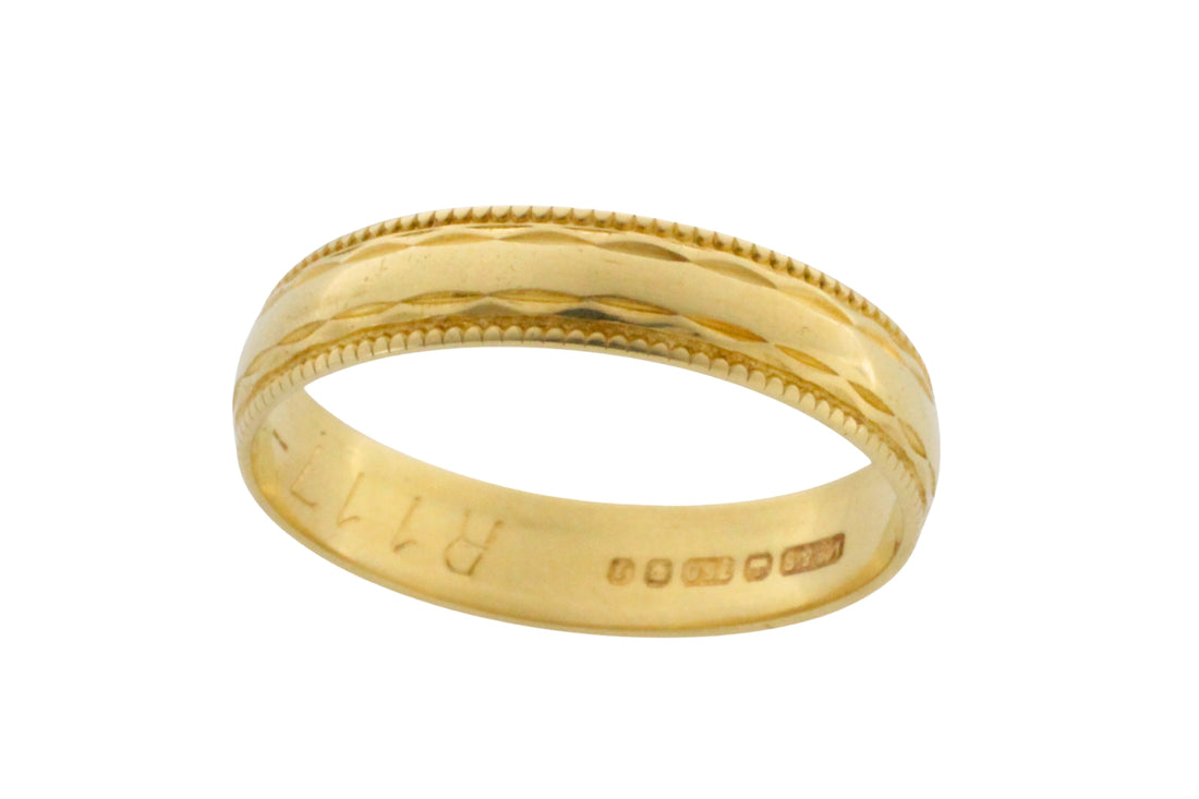 Vintage 18 carat gold band with motif