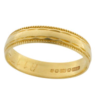 Vintage 18 carat gold band with motif