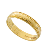 Vintage 18 carat gold band with motif
