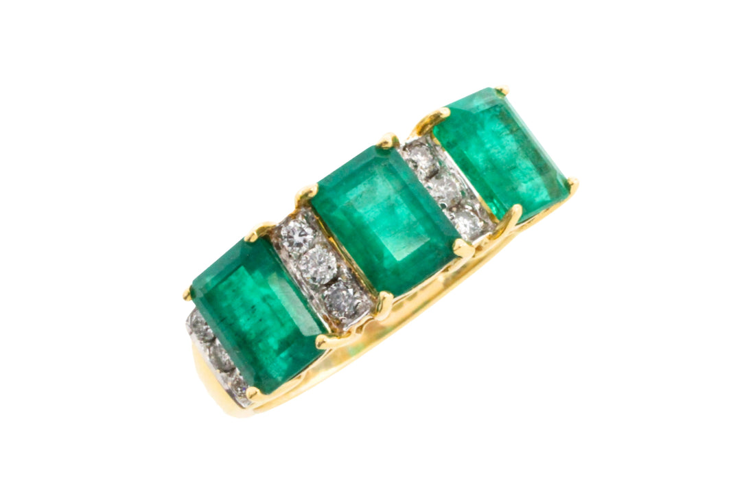 Emerald and diamond ring in 18 carat gold