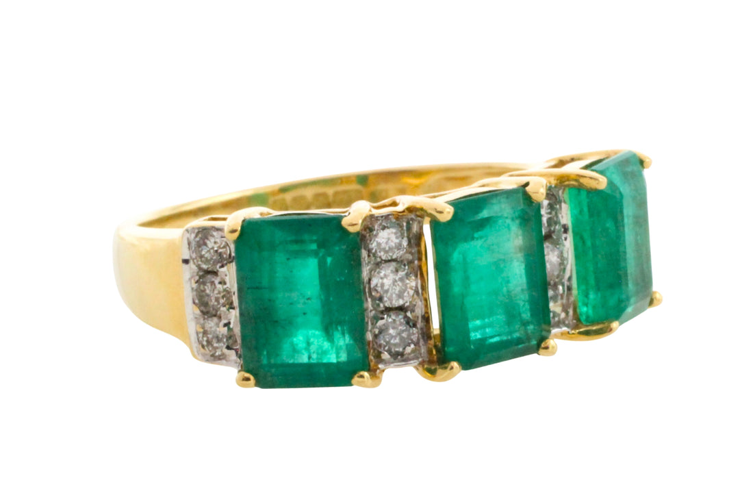 Emerald and diamond ring in 18 carat gold