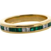 Emerald and diamond band in 18 carat gold