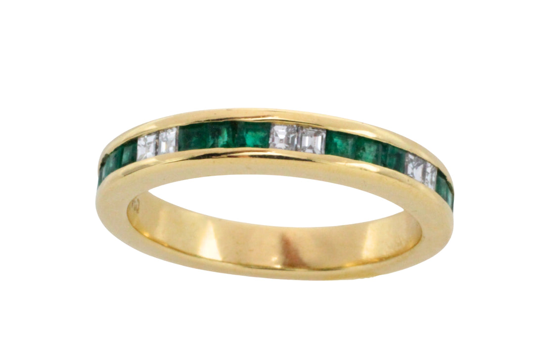 Emerald and diamond band in 18 carat gold