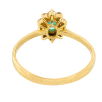 Emerald and diamond cluster ring in 18 carat gold