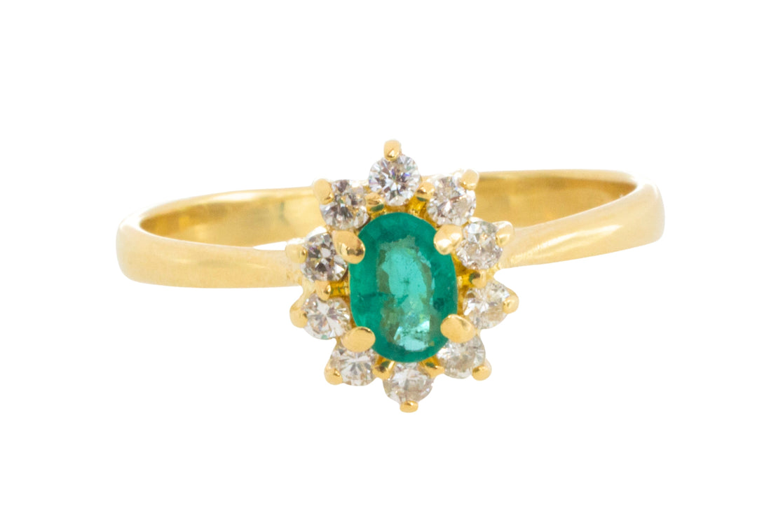 Emerald and diamond cluster ring in 18 carat gold