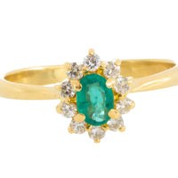 Emerald and diamond cluster ring in 18 carat gold