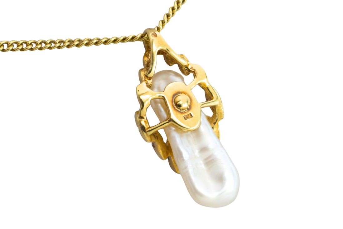 Baroque pearl and diamond pendant in 14 carat gold