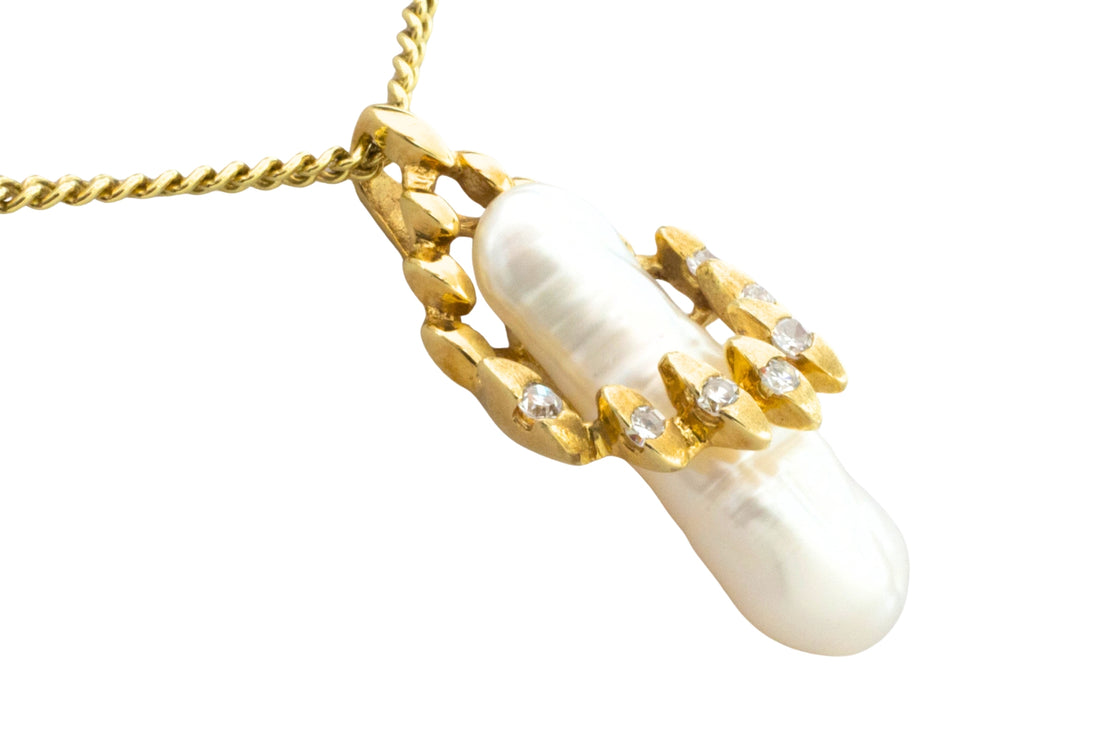 Baroque pearl and diamond pendant in 14 carat gold