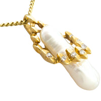 Baroque pearl and diamond pendant in 14 carat gold