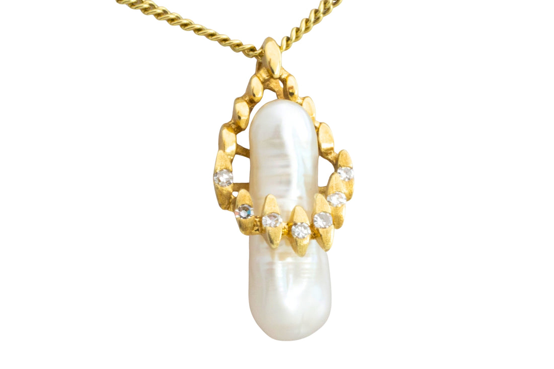 Baroque pearl and diamond pendant in 14 carat gold