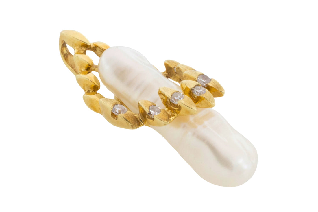 Baroque pearl and diamond pendant in 14 carat gold