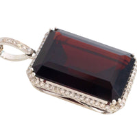Garnet and diamond pendant in white gold