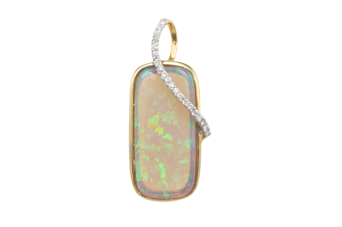 Opal and diamond pendant in 18 carat gold