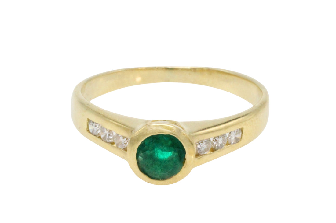 Emerald and diamond ring in 18 carat gold