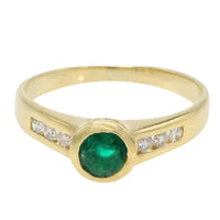 Emerald and diamond ring in 18 carat gold