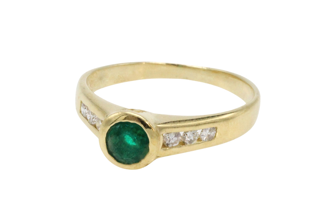 Emerald and diamond ring in 18 carat gold