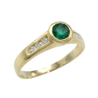 Emerald and diamond ring in 18 carat gold