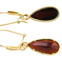 Garnet pendant earrings in 14 carat gold