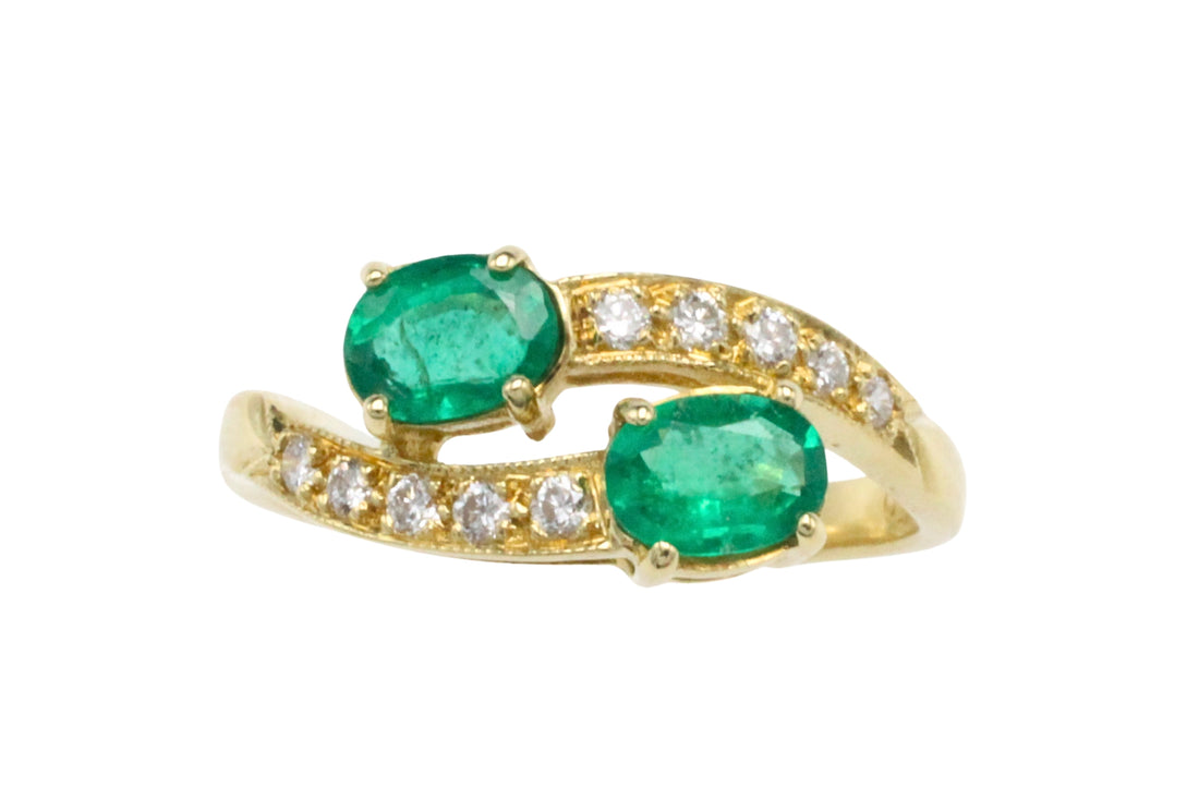 Vintage emerald and diamond crossover ring