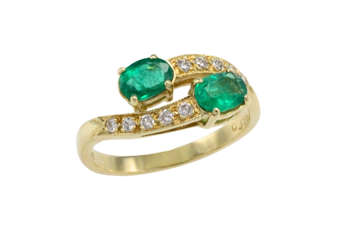 Vintage emerald and diamond crossover ring