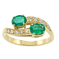 Vintage emerald and diamond crossover ring